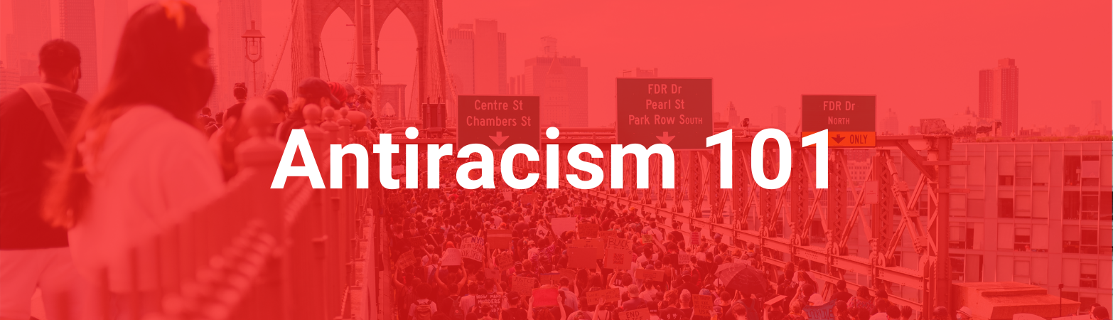 A crowd of activists on a bridge and highway. Text states, "Antiracism 101"