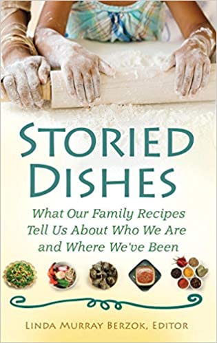 his book is organized around 50 short essays and recipes presented by women from multicultural backgrounds and dissimilar walks of life, including an Australian mother, a New Orleans family, and an Egyptian aunt. Book cover of "Storied Dishes : What Our Family Recipes Tell Us about Who We Are and Where We've Been"